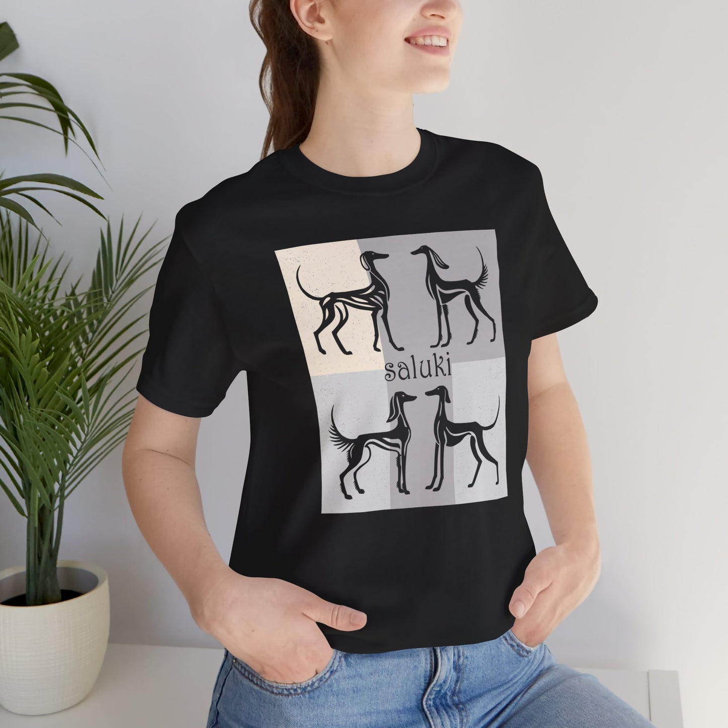 Unisex Jersey Short Sleeve Tee featuring a stylised graphic of a group of Salukis standing, looking onto the distance, with a background of matching tones..